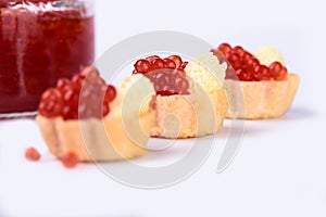 Selective focus. Tartlets with red caviar close up