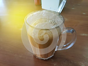 Selective focus of Tea with milk in a mug or popularly known as Teh Tarik in Malay language.