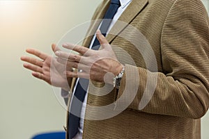 Selective focus on  teacher  while teaching and explaining lessons to students in classroom. Computer lab class, technology and