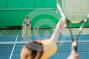 selective focus tennis player with stance ready to receive ball