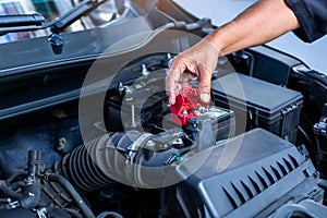 Selective focus to auto mechanic check and maintenance the battery in the car