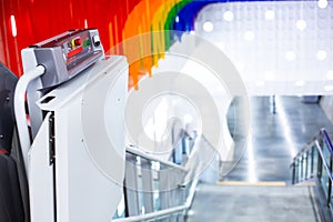 Selective focus to button switch panel of electric stairs for transporting disabled people in subway stations