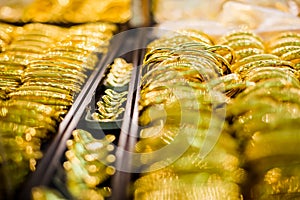 Selective focus to gold and bracelet are gold jewelry in the showcase