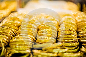 Selective focus to gold and bracelet are gold jewelry in the showcase