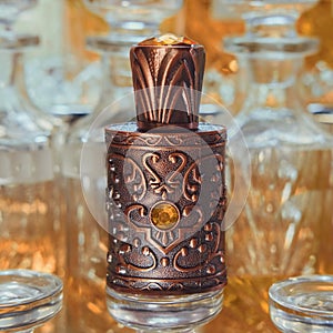 Selective Focus to Ornate Oriental Perfume Bottle close up on blurred Perfume Shop Display.
