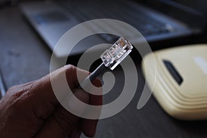 Selective focus to RJ45 Connector with crimping RJ45 tool on blurry background