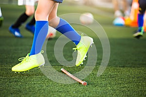 Selective focus to soccer players jumpping over hurdles marker photo