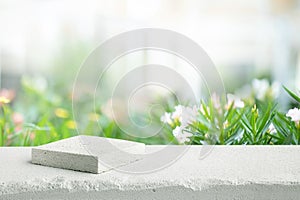 Selective focus.top sandstone product display platform with flower garden color