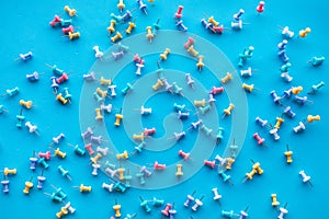 Selective focus /Top view group of pin,thumbtack on blue desk table background,business creativity ideas
