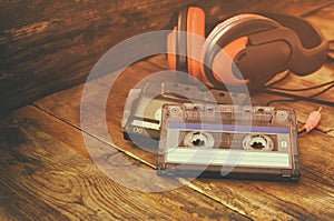 Selective focus of top view of vintage headphones and cassettes