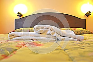 Selective focus of towels on the bed