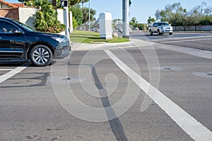 Selective focus on vehicle stopped in the crosswalk.