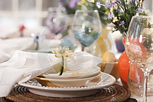 Selective focus view of Spring or Easter dining place settings