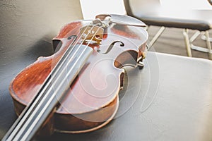 Selective focus of  Violin on musician chair