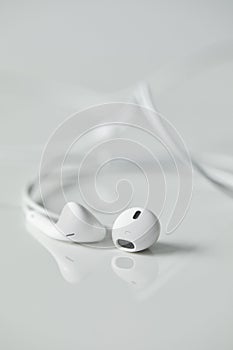 Selective focus of white wired earphones