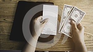 woman hand and cash as receipt bill food and drink for payment by cash of dollar in the