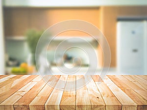 Selective focus.Wood table top on blur kitchen counter background