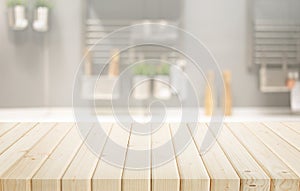 Selective focus.Wood table top on blur kitchen counter background