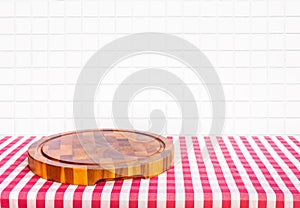 Selective focus.Wood table top with chopping board with blur kitchen counter background