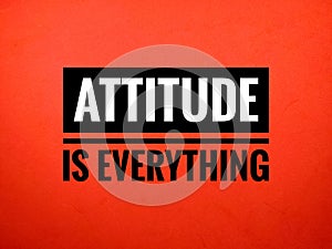 Selective focus.Word ATTITUDE IS EVERYTHING on red background.Motivation concept.