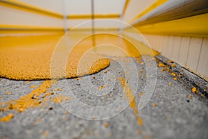 Selective focus on the yellow floor of freshly applied epoxy mortar system