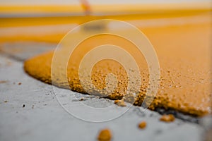 Selective focus on the yellow floor of freshly applied epoxy mortar system