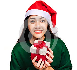 Selective focus Young beautiful asian woman wore green sweater and santa hat,Excited, surprised and happy, Holding a gift box with