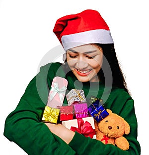 Selective focus Young beautiful asian woman wore green sweater and santa hat,Excited, surprised and happy, Holding a gift box with