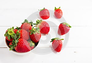 In selective of the red strawberry in ceramic bowl