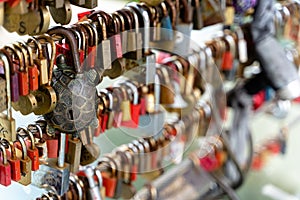 Selective shot of metal locks left by people on a bridge In Ljubljana, Slovenia - keep a dream