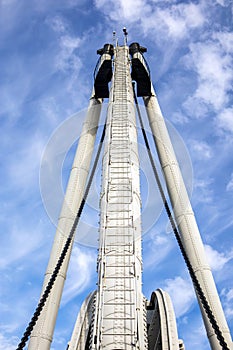 Selective view of floating ship crane under the cloudy sky