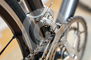 Selective view of a sport bicycle`s front derailleur