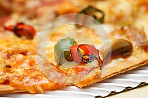 Selectived focus on topping on pizza background