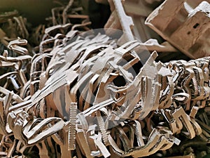 Selelctive focus close up image of brown shredded paper filler for postal package.