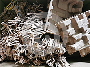 Selelctive focus close up image of brown shredded paper filler for postal package.