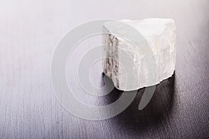 Selenite stone on wood photo
