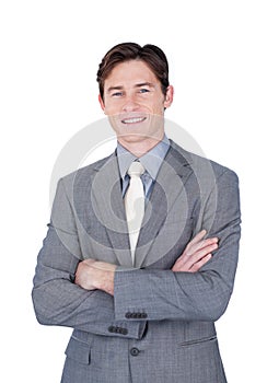 Self-assured businessman standing with folded arms photo