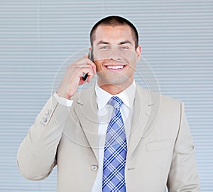 Self-assured businessman talking on phone photo