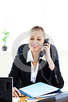 Self-assured businesswoman talking on phone photo