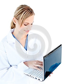 Self-assured female doctor holding a laptop photo