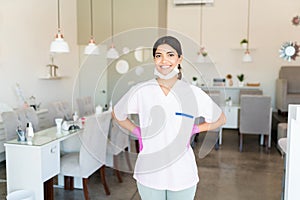 Self-Assured Salon Worker Smiling In Uniform