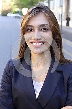 Self assured sophisticated lady walking on the sidewalk