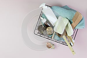 Self-care kit for body, hair, face, shower accessories in a basket on a marble background. concept zero waste, sustainable. copy