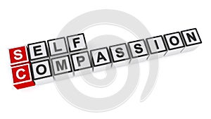 Self compassion word block on white photo