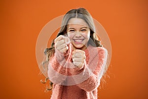 Self defense strategies kids can use against bullies. Girl hold fists ready attack or defend. Girl child cute but strong photo