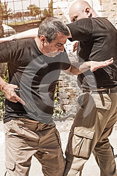 Self defense techniques against a gun