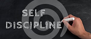 Self discipline is standing on a chalkboard, improvement by education, willpower to reach a goal