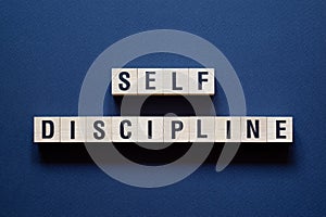 Self Discipline - word concept on cubes,text