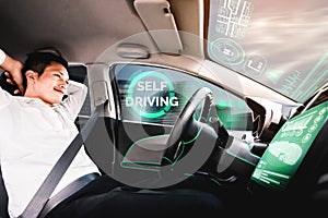 Self-drive autonomous car with man at driver seat.