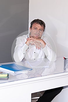 Self employed business entrepreneur man working on desk at home